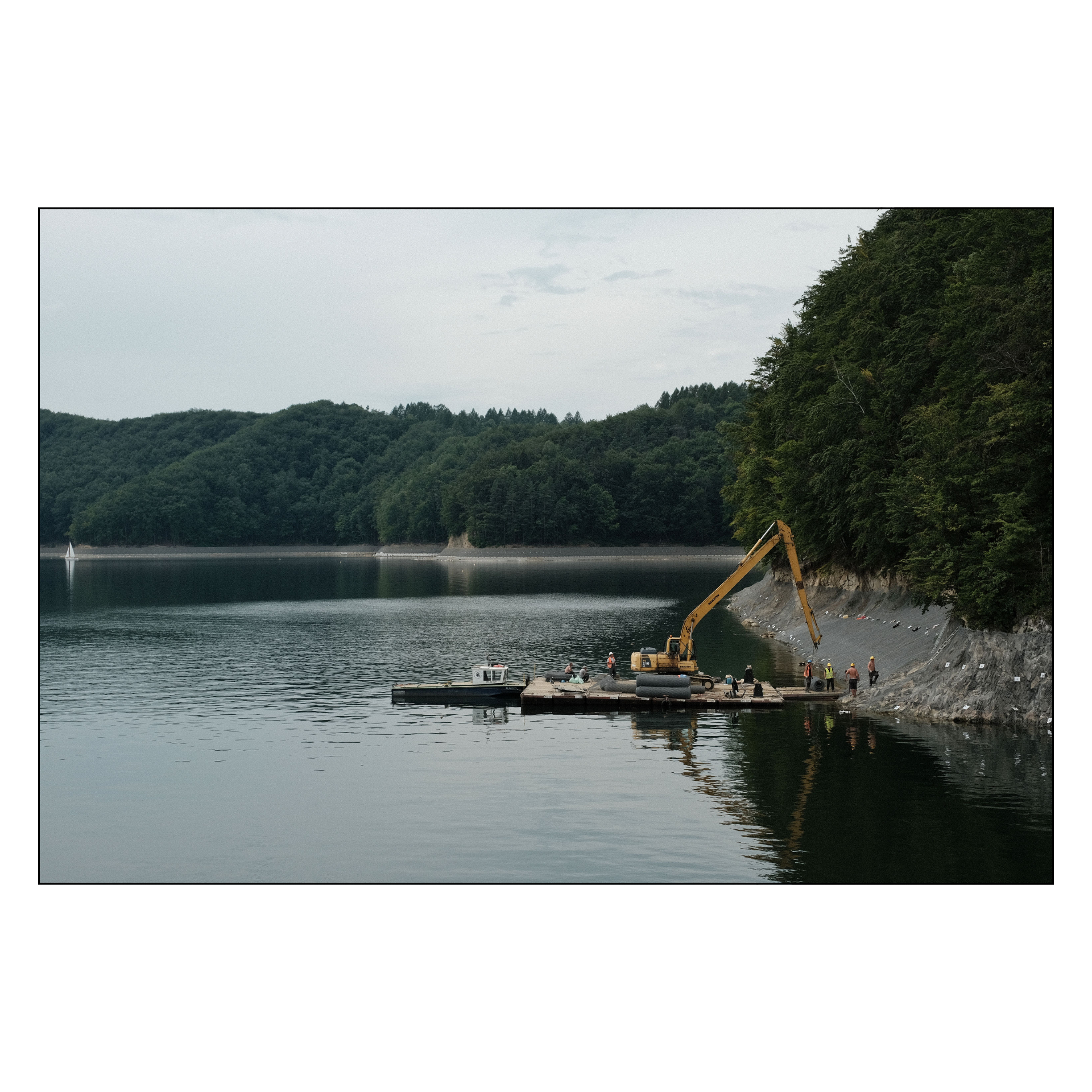 construction workers on a lake
